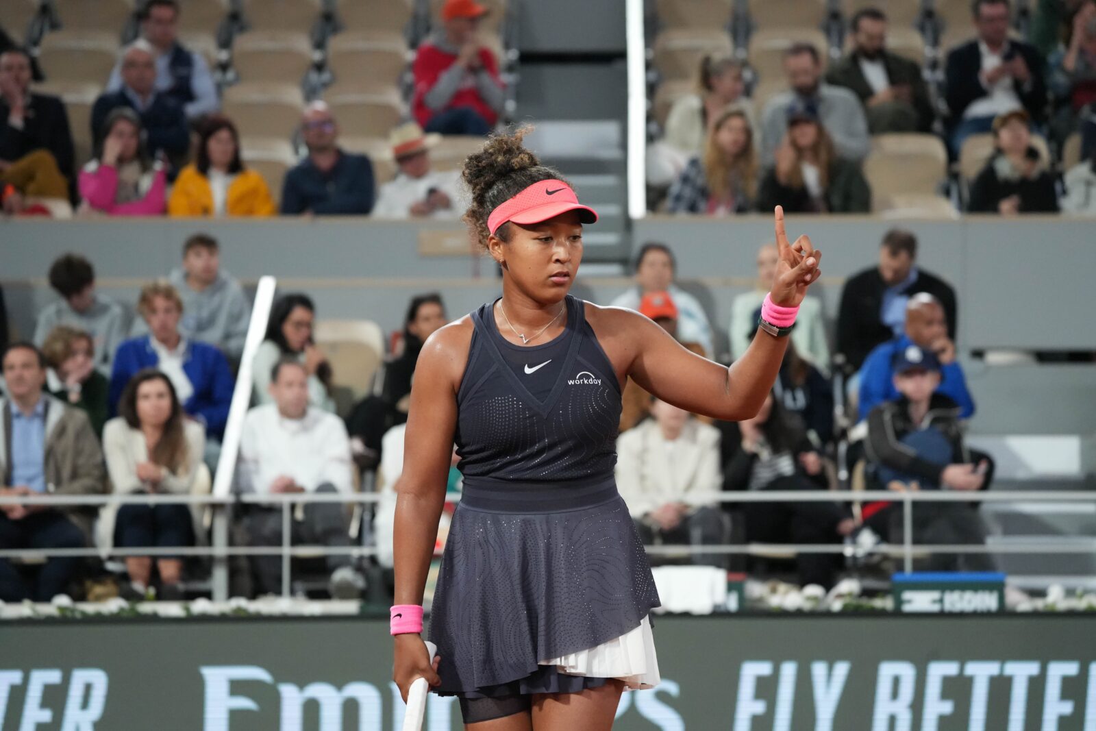 a woman holding a tennis racket