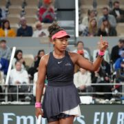 a woman holding a tennis racket