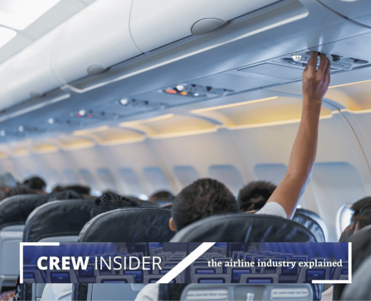 a person touching the ceiling of an airplane