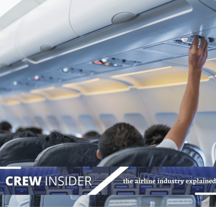 a person touching the ceiling of an airplane