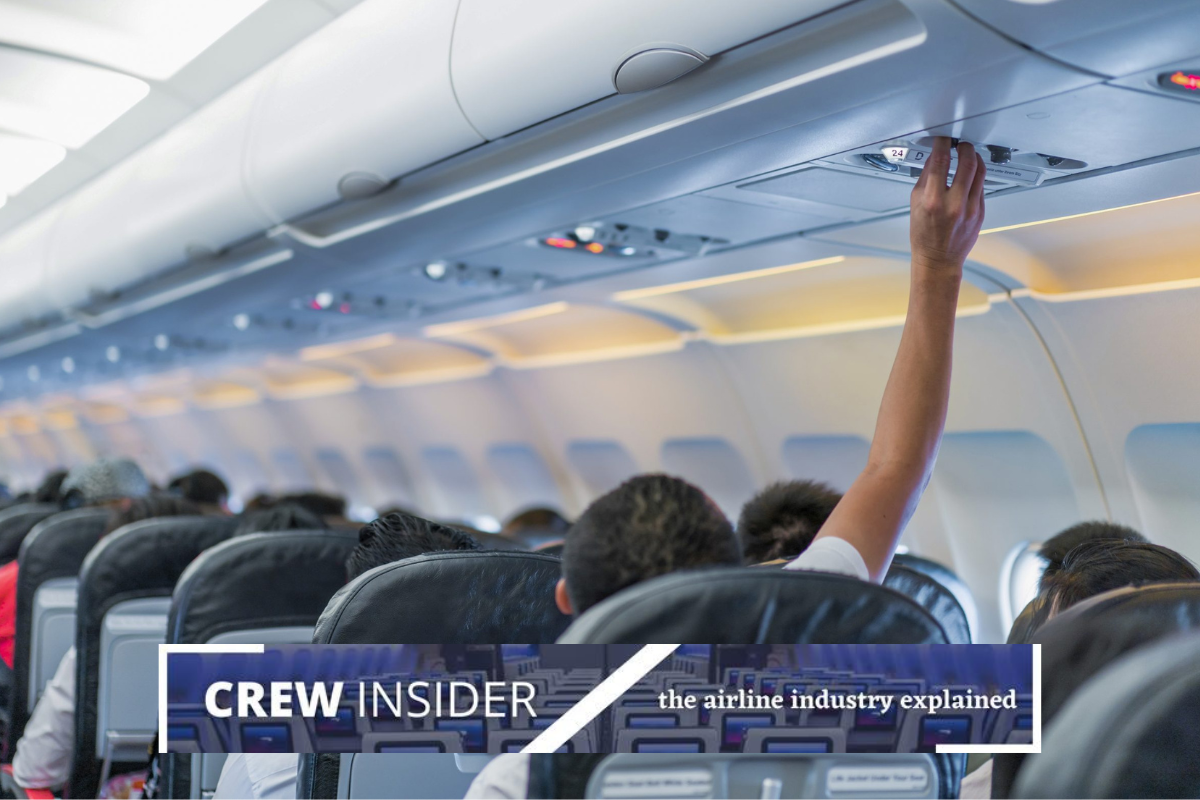 a person touching the ceiling of an airplane