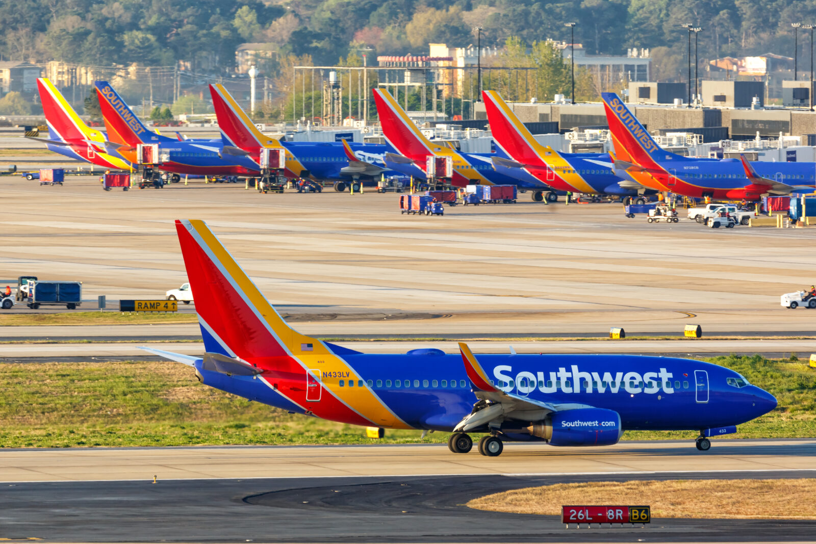 a group of airplanes on a runway