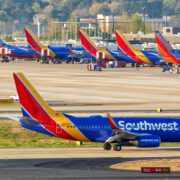 a group of airplanes on a runway