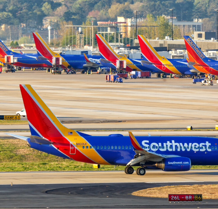 a group of airplanes on a runway