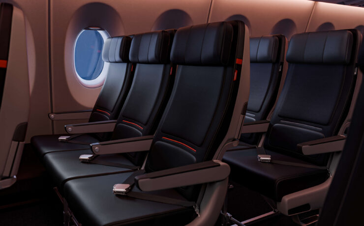 a row of black seats in an airplane