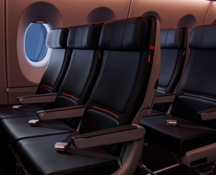 a row of black seats in an airplane