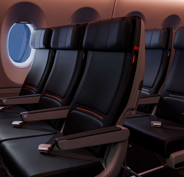 a row of black seats in an airplane