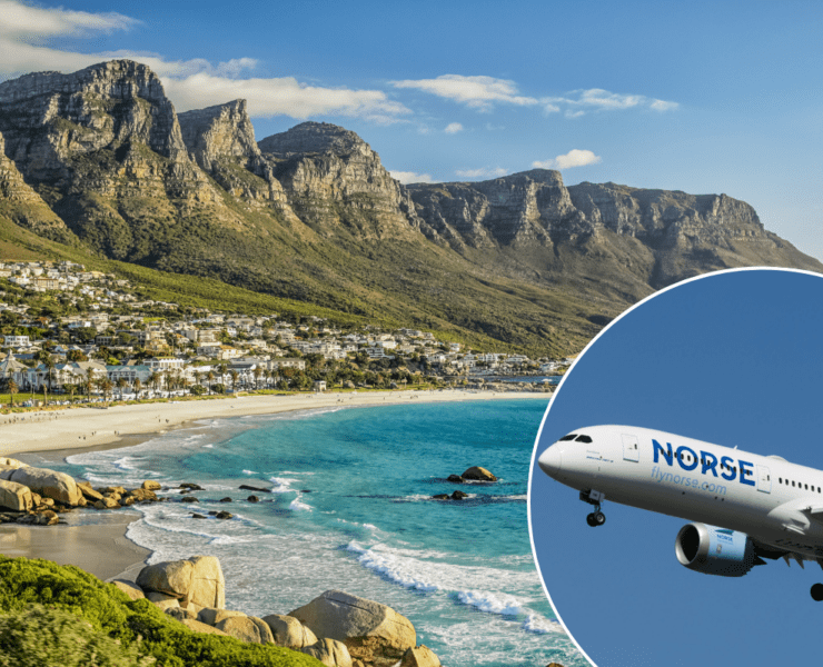 a plane flying over a beach