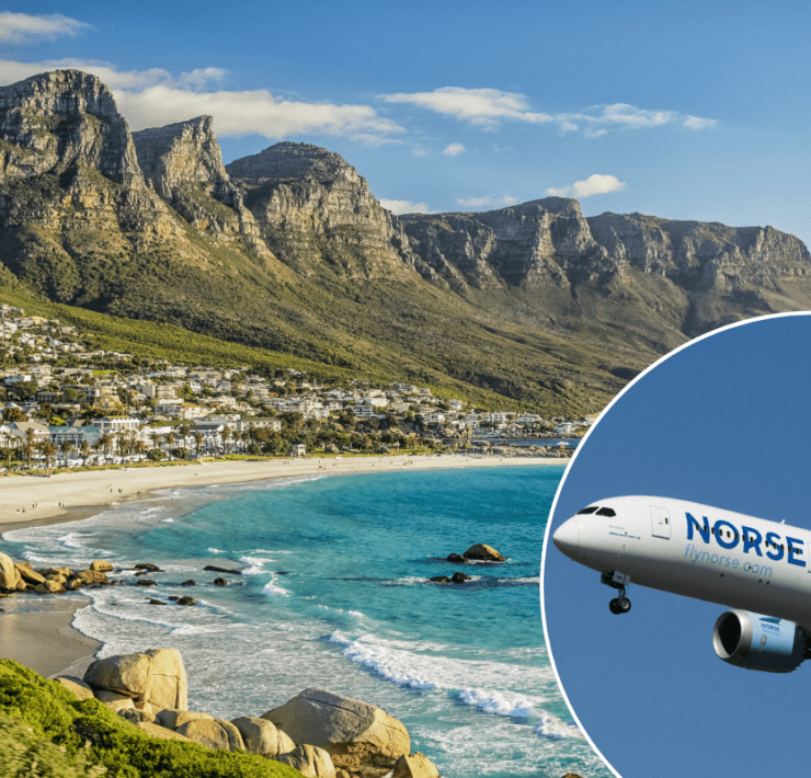 a plane flying over a beach