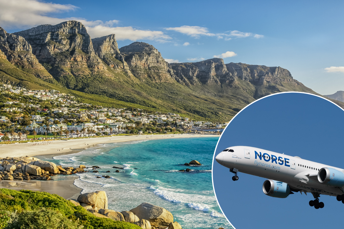 a plane flying over a beach