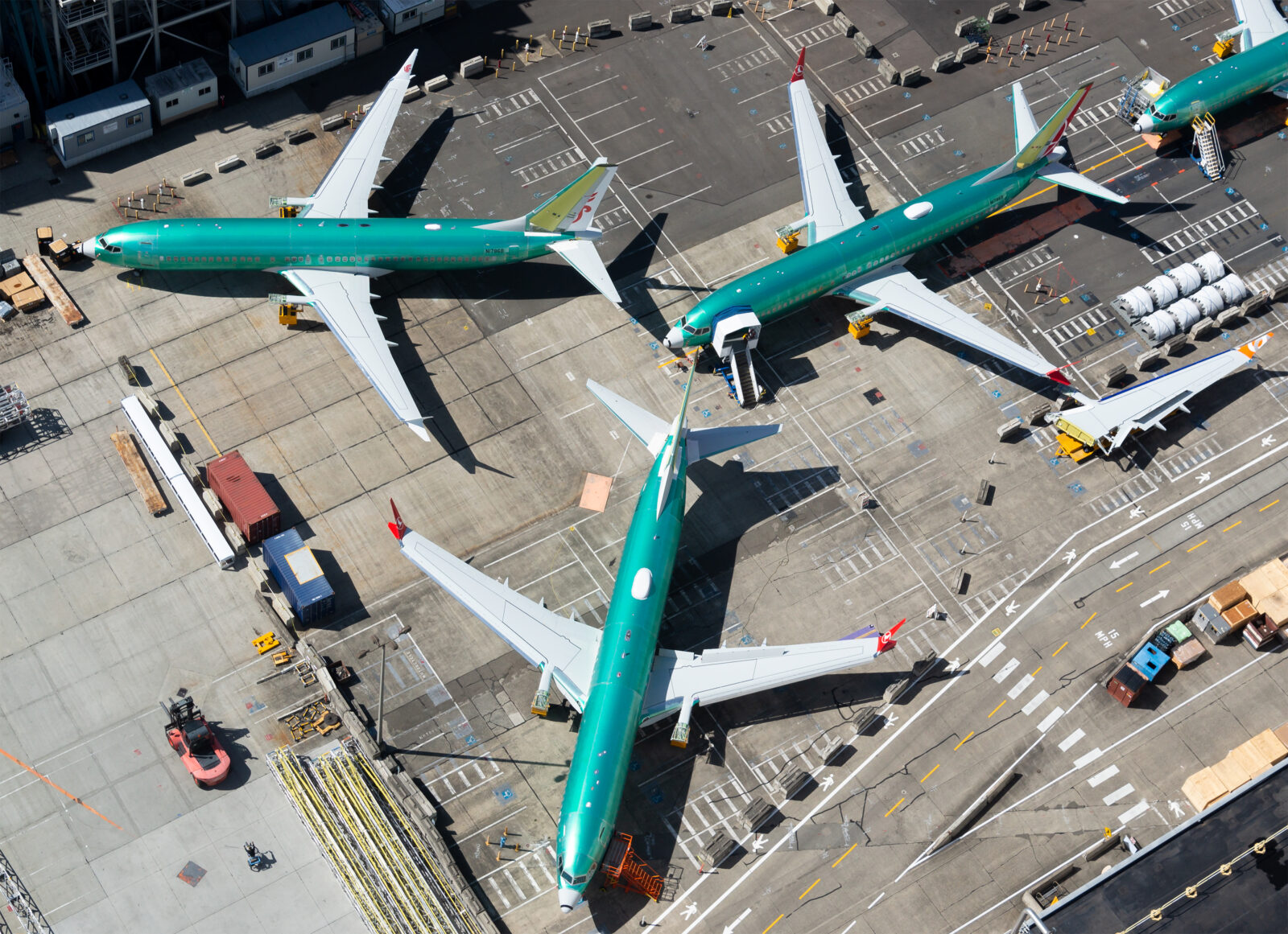 a group of airplanes on a runway