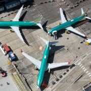 a group of airplanes on a runway