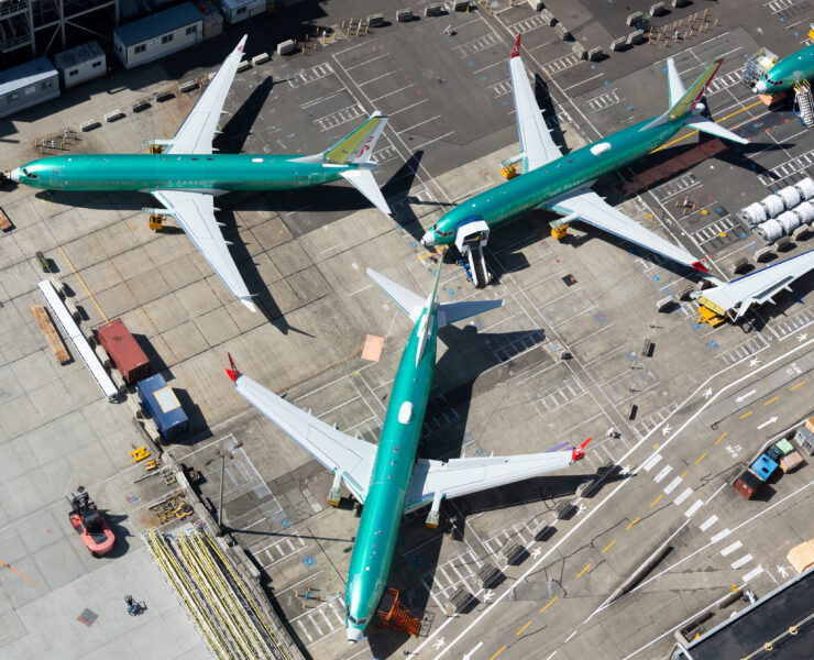 a group of airplanes on a runway