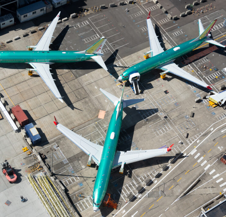 a group of airplanes on a runway