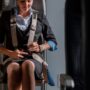 a woman sitting in a chair with a seat belt