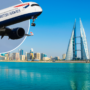 a plane flying over water and a city