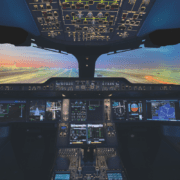 the cockpit of an airplane with multiple screens and a runway