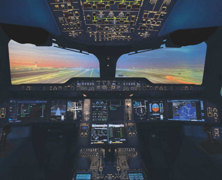 the cockpit of an airplane with multiple screens and a runway