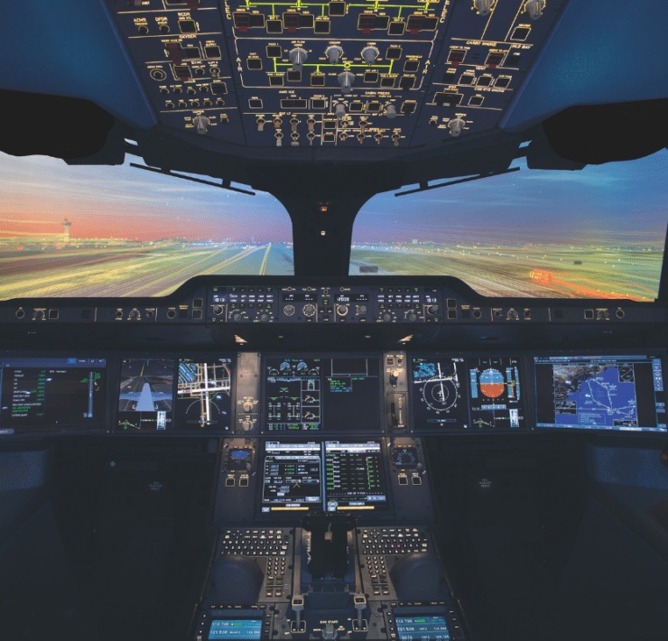 the cockpit of an airplane with multiple screens and a runway