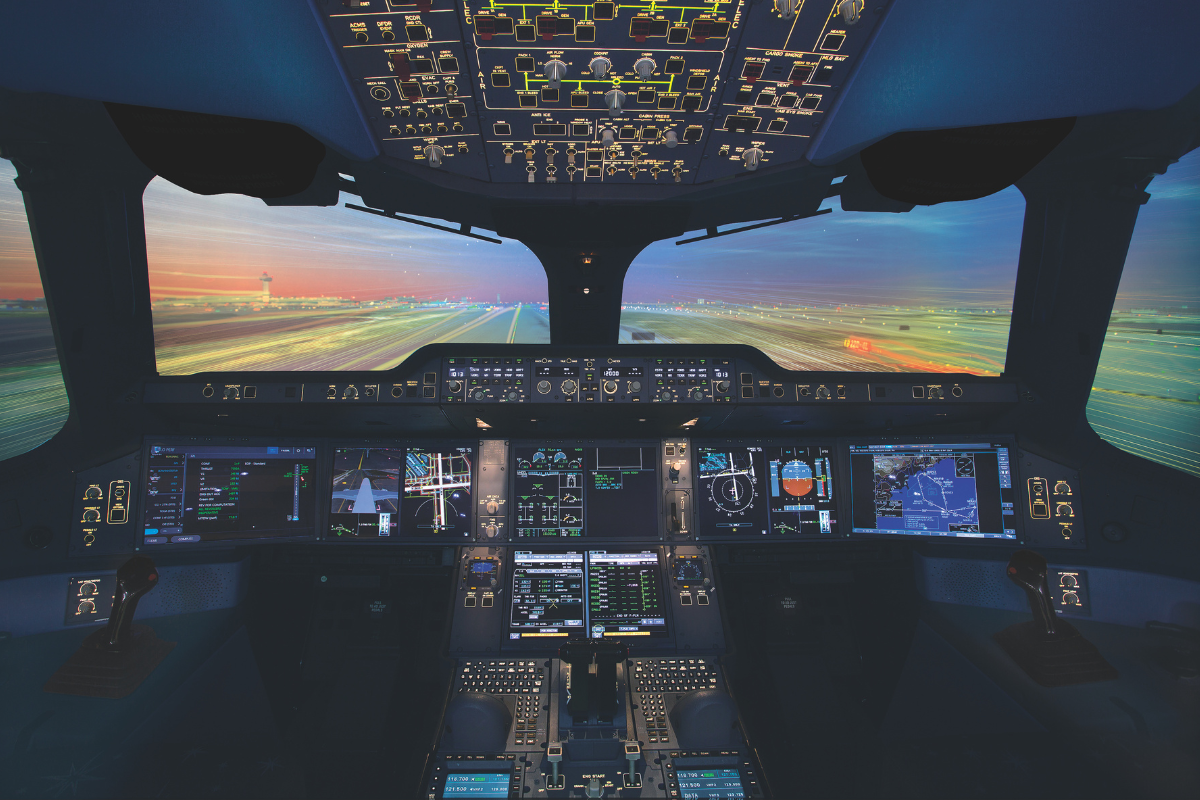 the cockpit of an airplane with multiple screens and a runway