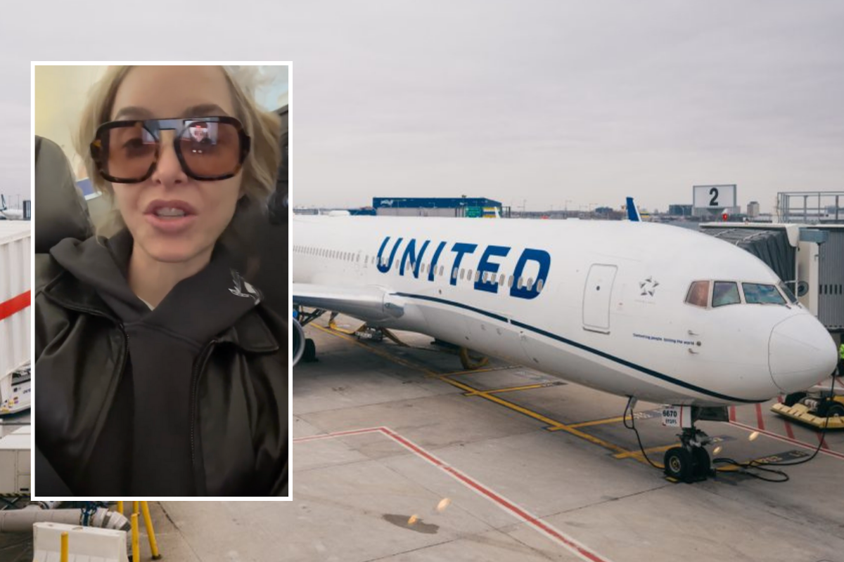 a woman taking a selfie in front of an airplane