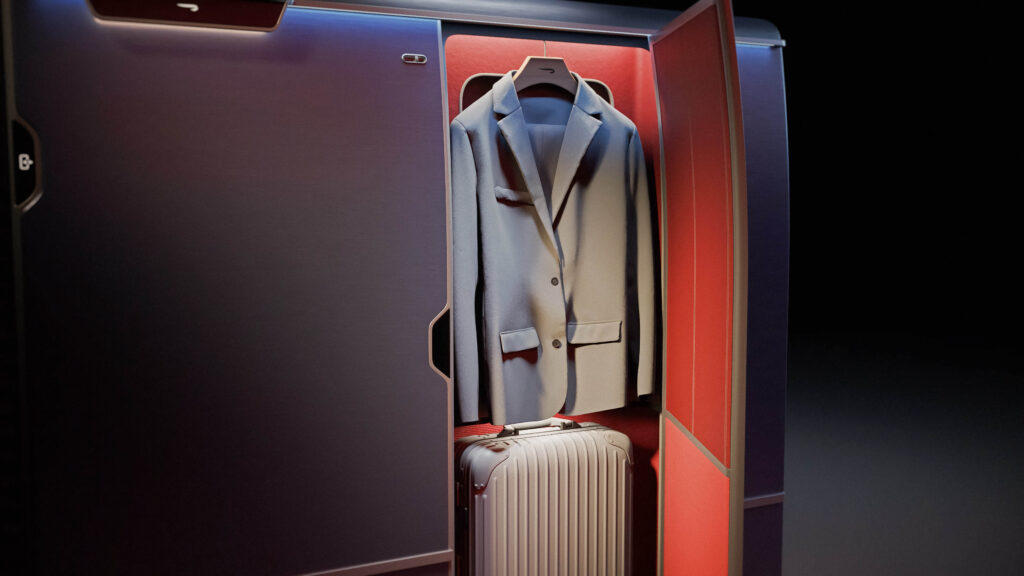 a suit jacket and luggage inside a cabin