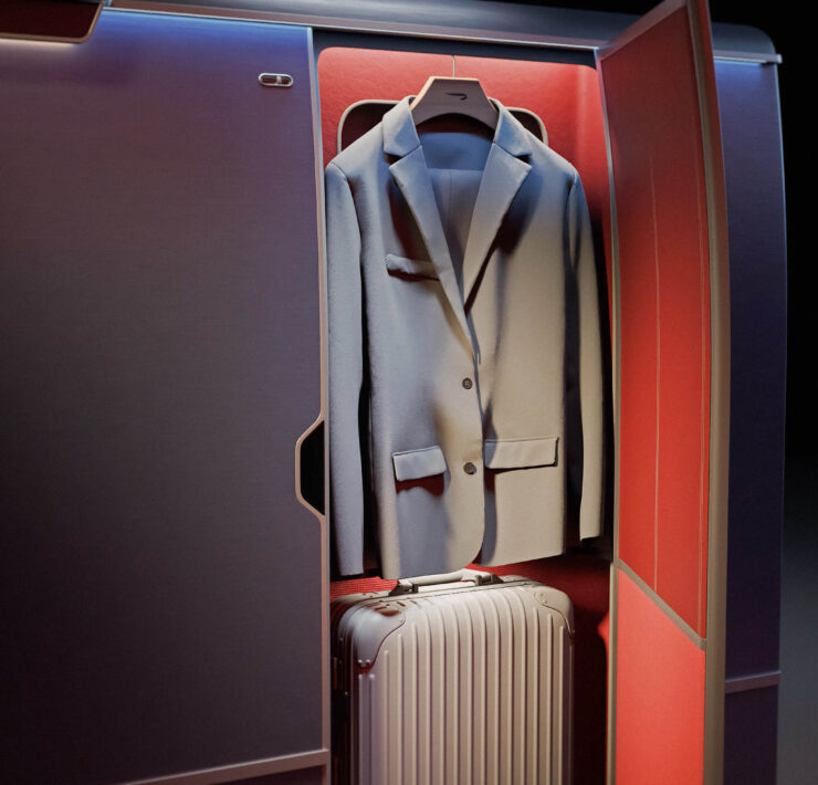 a suit jacket and luggage inside a cabin