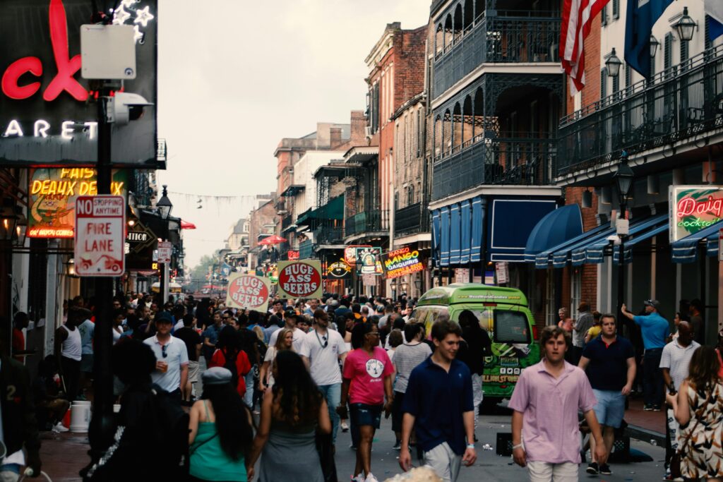 a crowd of people walking down a street