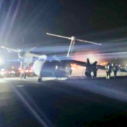 a plane on the runway at night