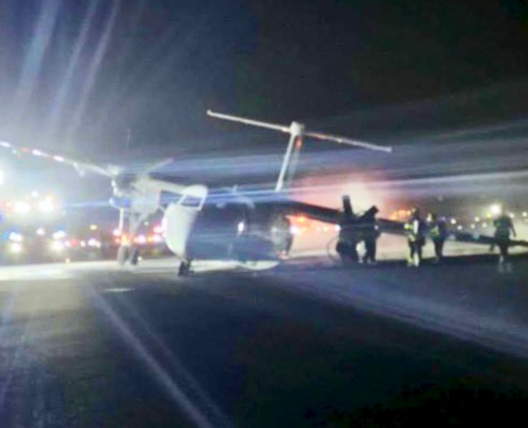 a plane on the runway at night