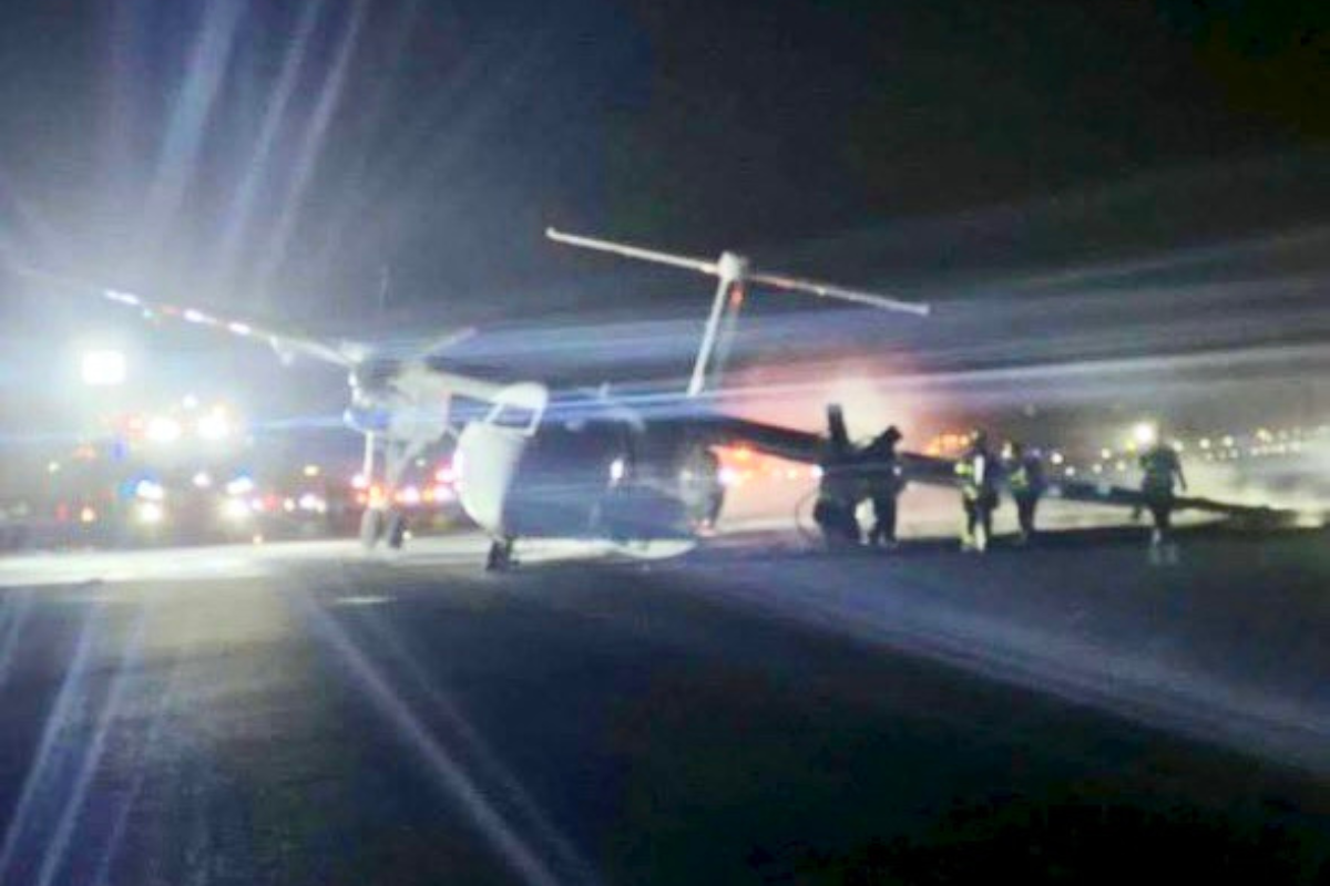 a plane on the runway at night