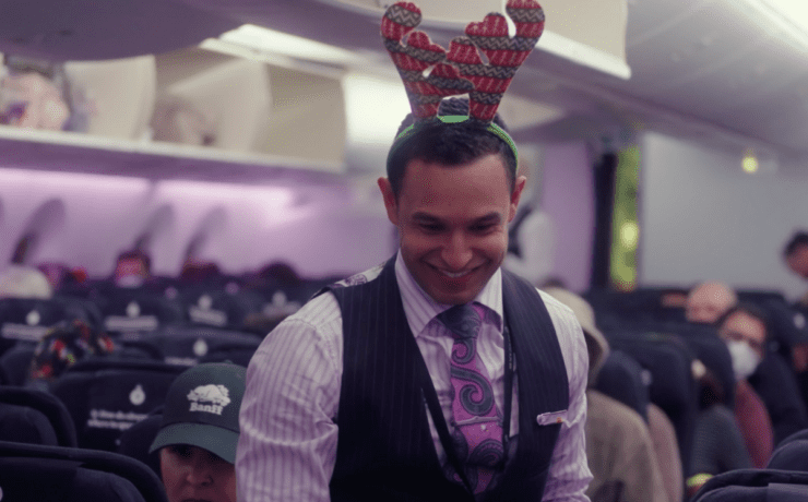 a man wearing a reindeer headband