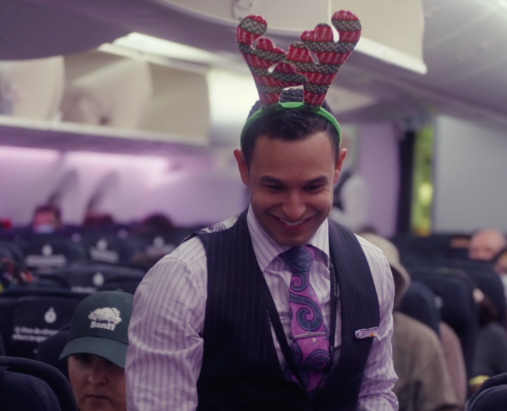 a man wearing a reindeer headband