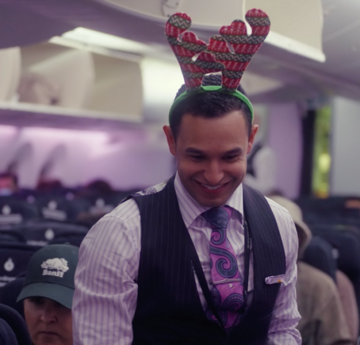 a man wearing a reindeer headband