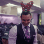 a man wearing a reindeer headband