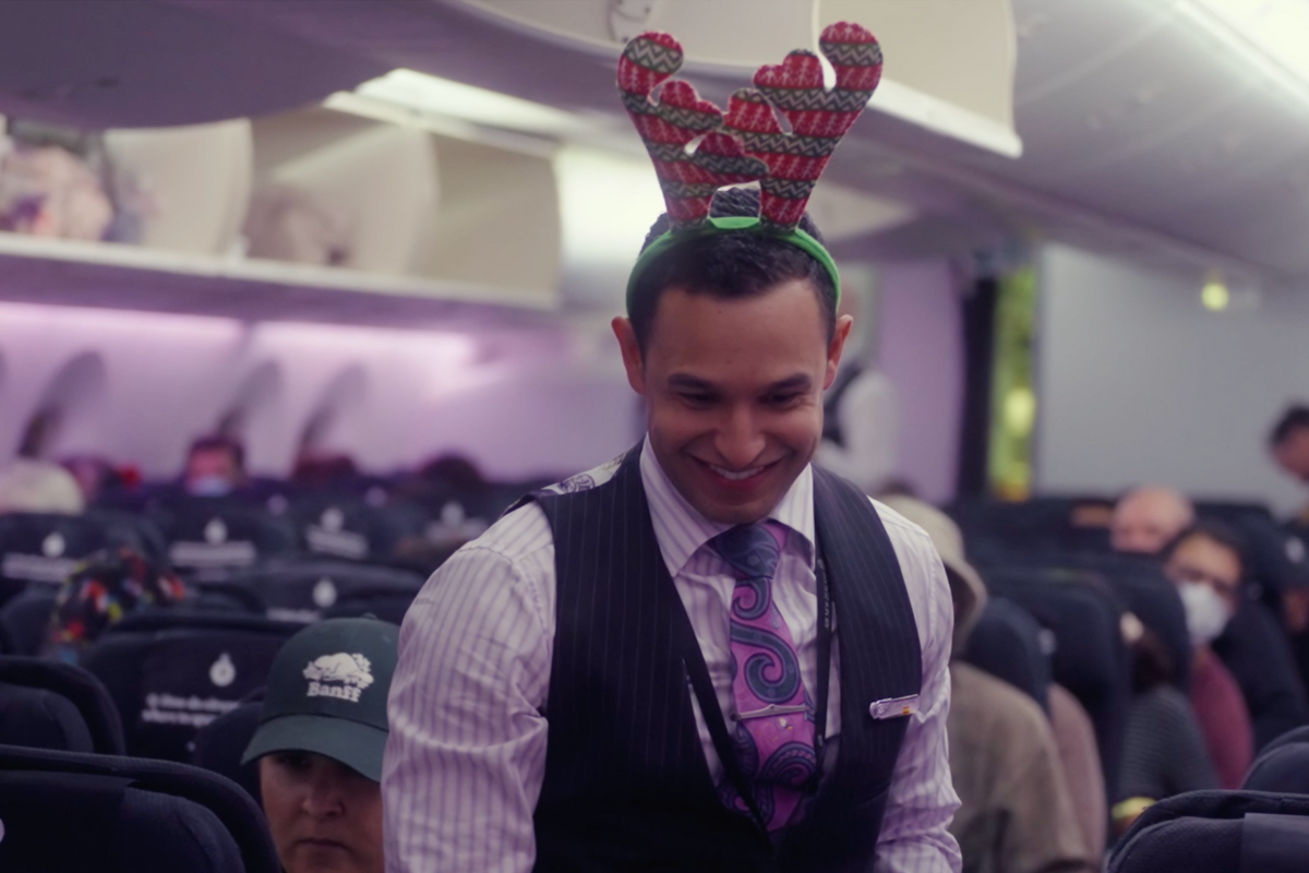 a man wearing a reindeer headband