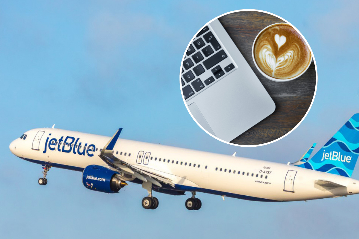 a plane flying in the sky with a laptop and a cup of coffee