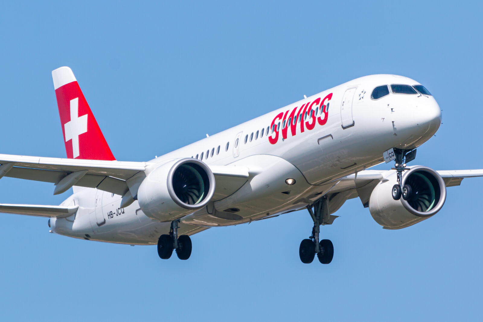 a white airplane with red writing