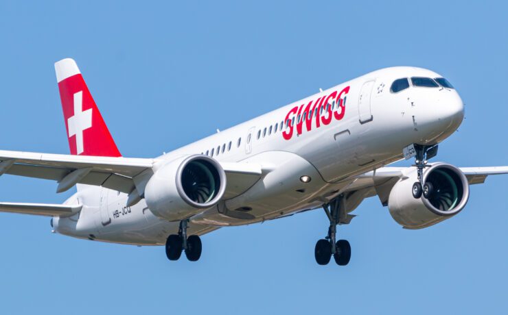 a white airplane with red writing