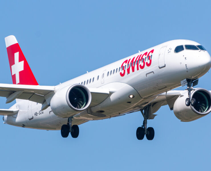 a white airplane with red writing