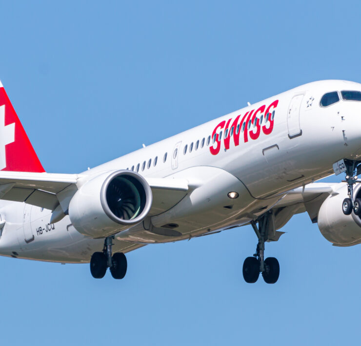 a white airplane with red writing