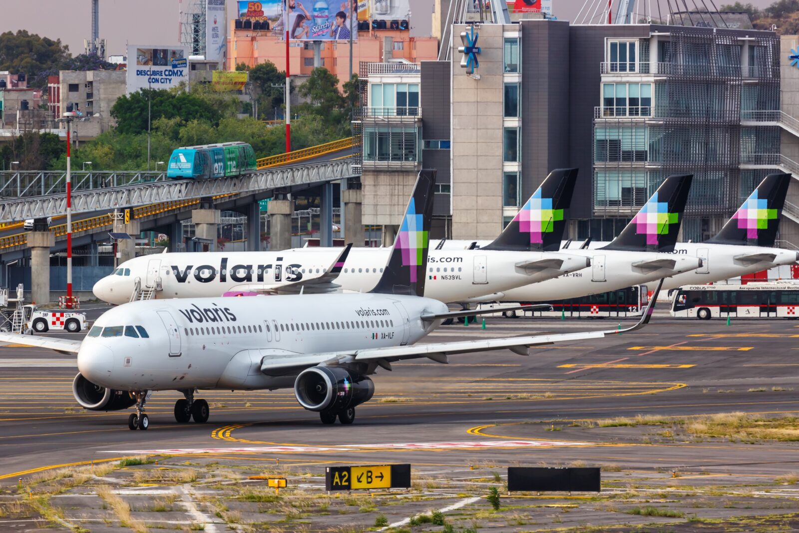 a group of airplanes parked on a runway