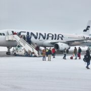 a group of people boarding an airplane