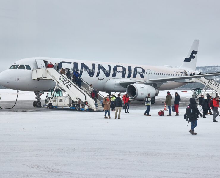 a group of people boarding an airplane