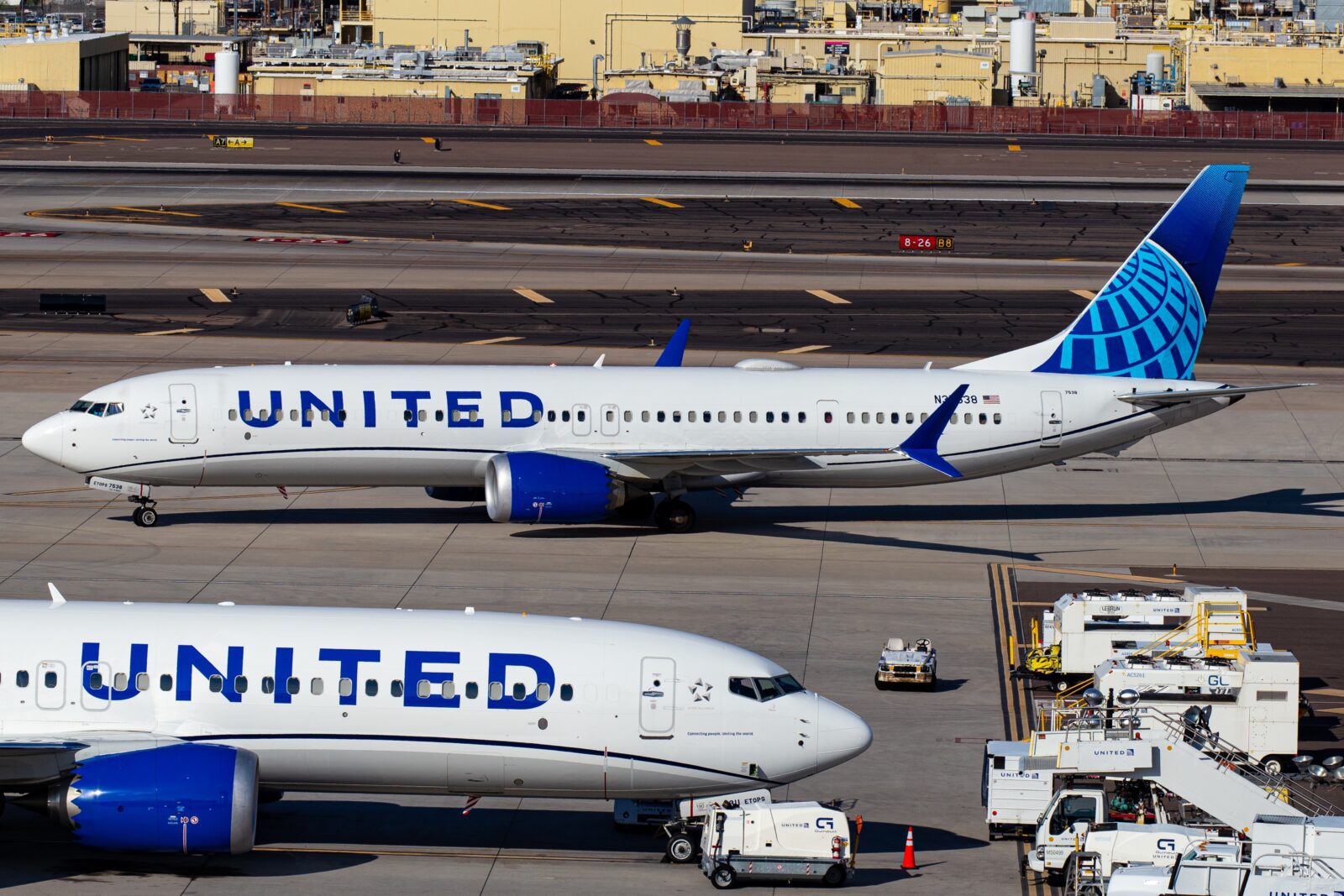 a group of airplanes on a runway