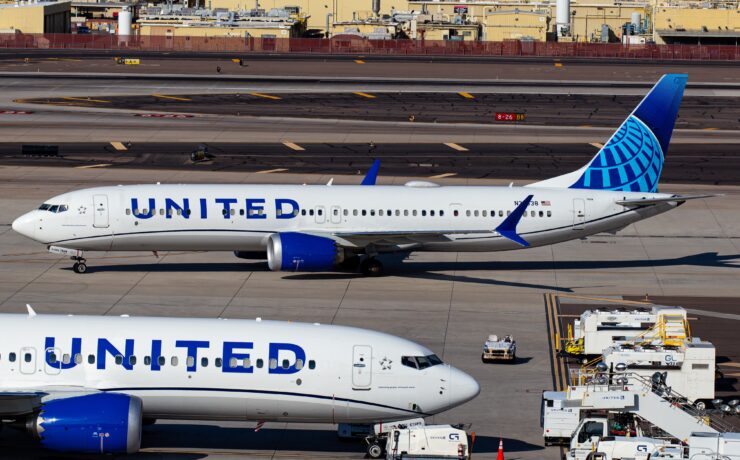 a group of airplanes on a runway