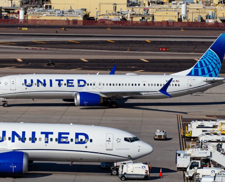 a group of airplanes on a runway