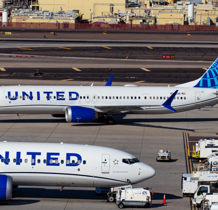 a group of airplanes on a runway