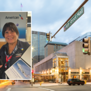 a street sign and a woman on the corner of a street