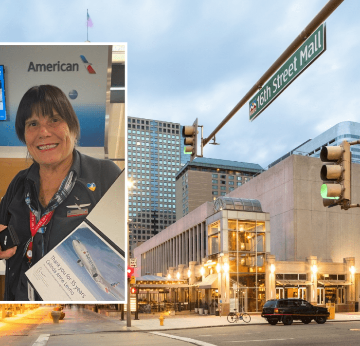 a street sign and a woman on the corner of a street